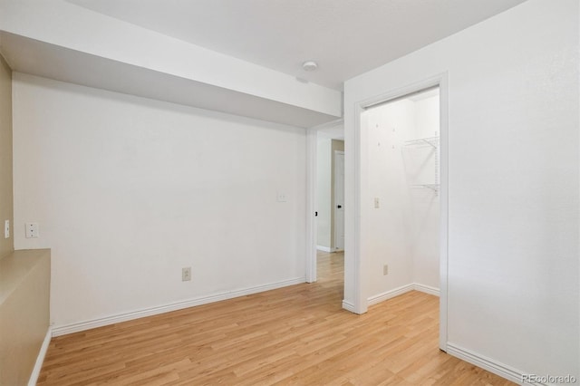 4947 S Espana Way, Centennial, CO 80015 - spare room with light wood-style flooring and a smoke detector