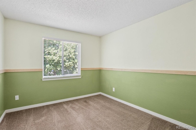 4947 S Espana Way, Centennial, CO 80015 - empty room featuring carpet and a textured ceiling