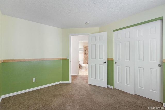 4947 S Espana Way, Centennial, CO 80015 - unfurnished bedroom with carpet flooring, a textured ceiling, and a closet