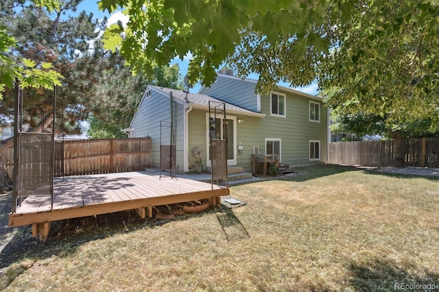 4947 S Espana Way, Centennial, CO 80015 - rear view of property featuring a fenced backyard, a deck, and entry steps