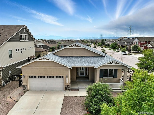8205 Birch Tree Loop, Colorado Springs, CO 80927 - view of front facade featuring a residential view, stucco siding, an attached garage, concrete driveway, and a shingled roof
