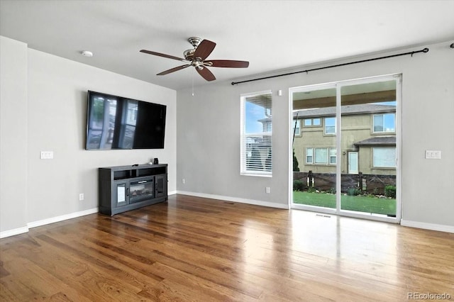 8205 Birch Tree Loop, Colorado Springs, CO 80927 - unfurnished living room with wood finished floors and a ceiling fan