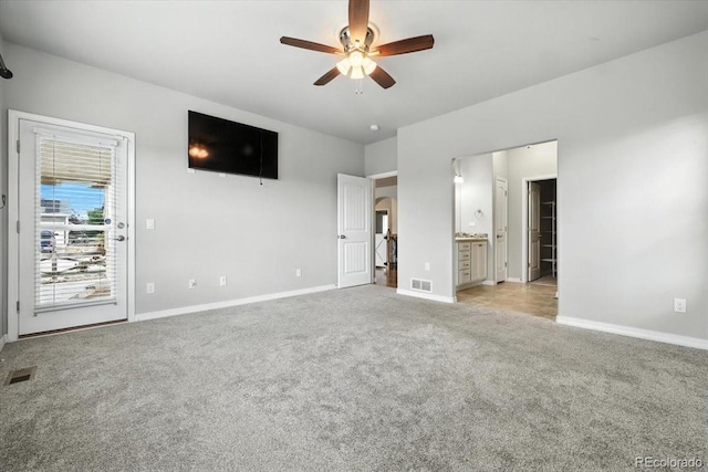 8205 Birch Tree Loop, Colorado Springs, CO 80927 - unfurnished bedroom featuring carpet flooring, connected bathroom, access to outside, arched walkways, and a ceiling fan