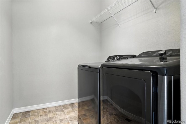 8205 Birch Tree Loop, Colorado Springs, CO 80927 - washroom with washer and dryer and baseboards