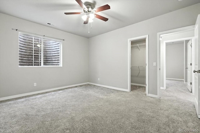 8205 Birch Tree Loop, Colorado Springs, CO 80927 - unfurnished bedroom featuring carpet, a spacious closet, and a ceiling fan
