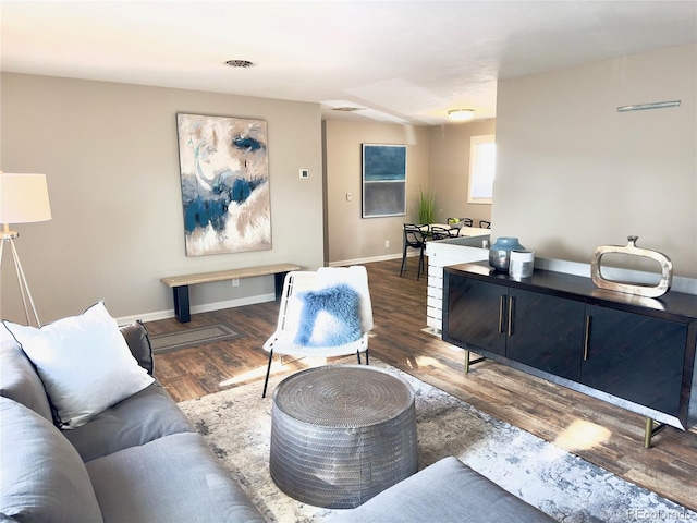 living room with dark wood-type flooring