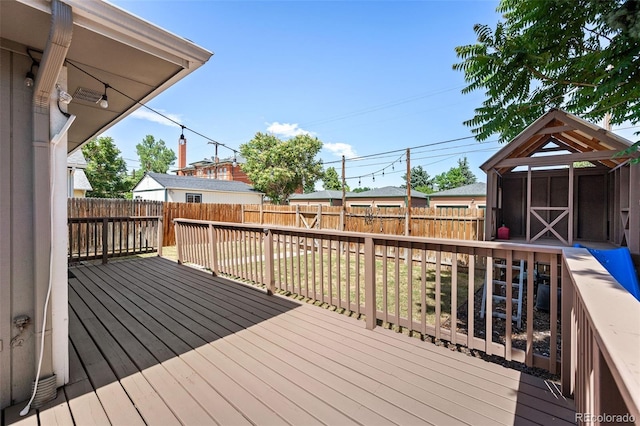 wooden deck with a shed