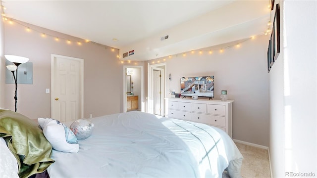 bedroom featuring light carpet