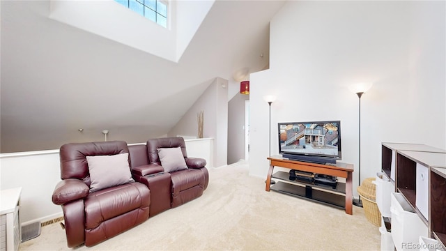 cinema featuring vaulted ceiling and carpet