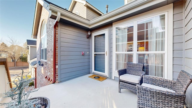 entrance to property featuring a patio