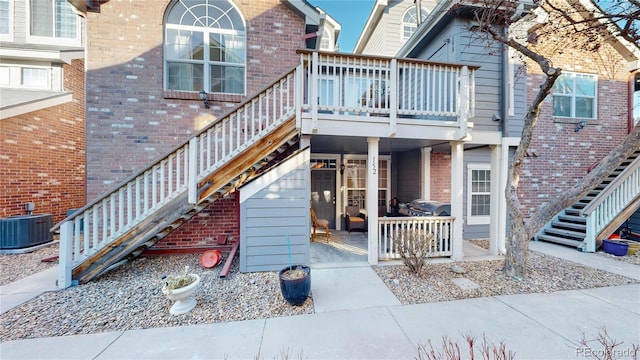 rear view of house with cooling unit and a patio