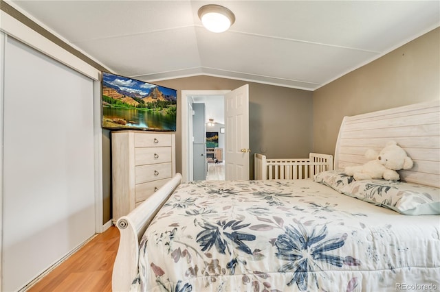 8426 Cook Way, Denver, CO 80229 - bedroom with light wood-style floors and lofted ceiling