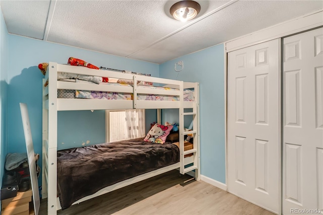 8426 Cook Way, Denver, CO 80229 - bedroom with wood finished floors and a textured ceiling