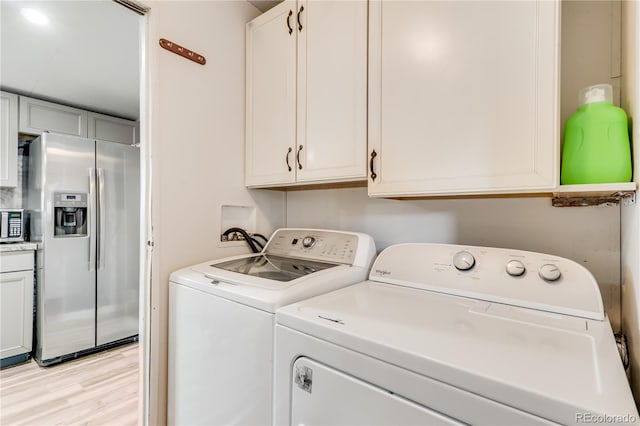 8426 Cook Way, Denver, CO 80229 - laundry room featuring washer and clothes dryer and light wood-type flooring