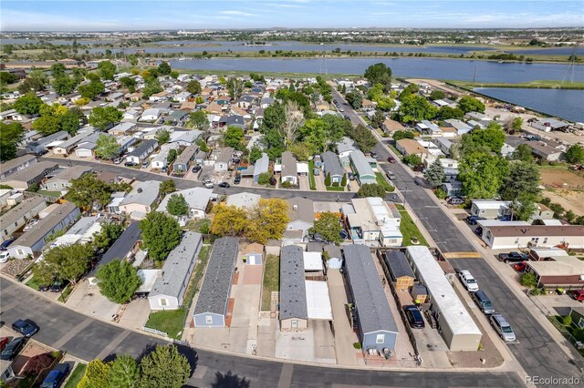 8426 Cook Way, Denver, CO 80229 - aerial view of property and surrounding area featuring a large body of water and nearby suburban area