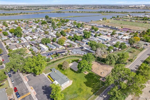 8426 Cook Way, Denver, CO 80229 - aerial view of property and surrounding area with a large body of water and nearby suburban area