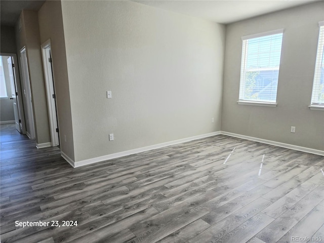 spare room with hardwood / wood-style floors