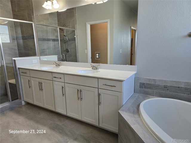 bathroom with plus walk in shower, tile patterned floors, and vanity