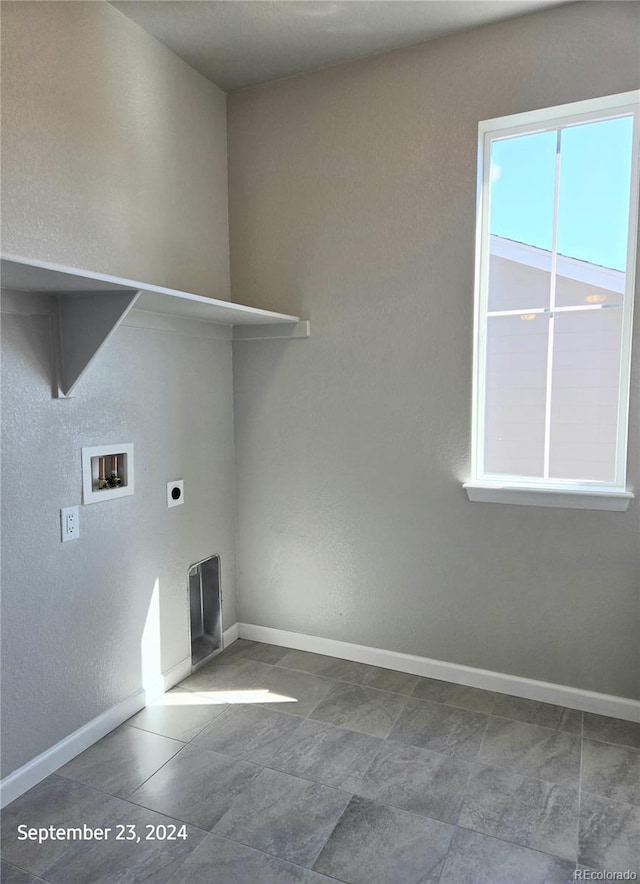 laundry area with hookup for a washing machine and hookup for an electric dryer