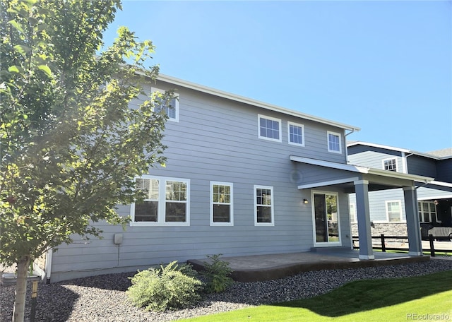 rear view of house with a patio area