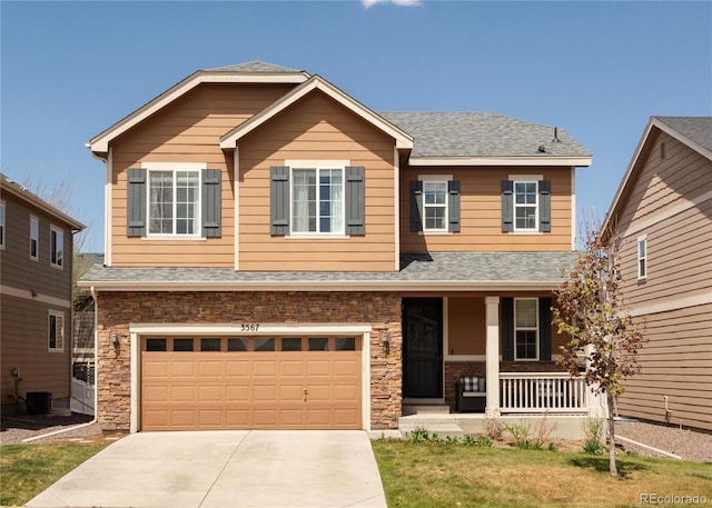 craftsman house featuring roof with shingles, an attached garage, concrete driveway, and a porch
