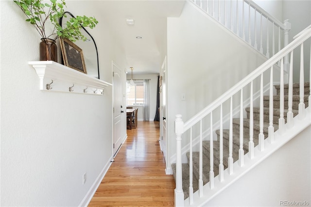 interior space with light wood-type flooring and stairs