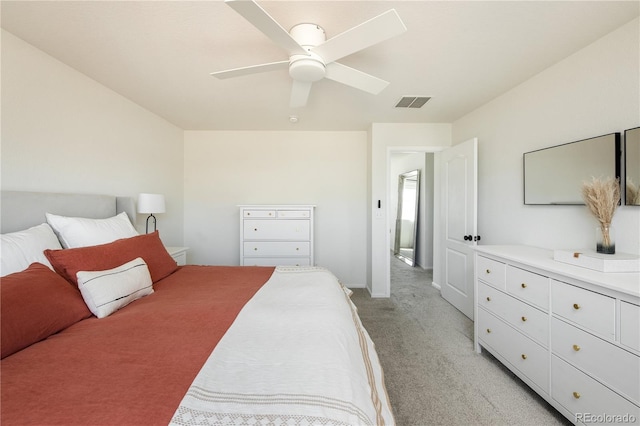 bedroom with a ceiling fan, light colored carpet, and visible vents