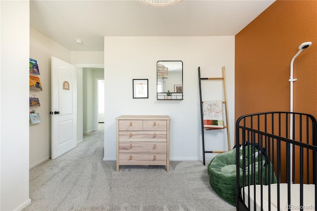 bedroom featuring baseboards and carpet