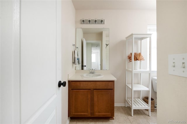 bathroom featuring toilet, tile patterned floors, and vanity