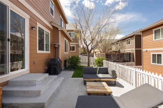 view of patio / terrace with outdoor lounge area, fence, and grilling area