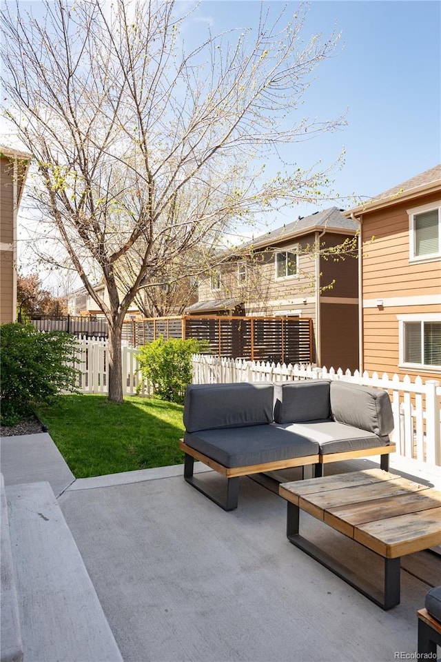 view of patio / terrace featuring an outdoor living space and fence private yard