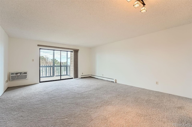 unfurnished room featuring baseboard heating, a wall mounted AC, carpet flooring, and a textured ceiling