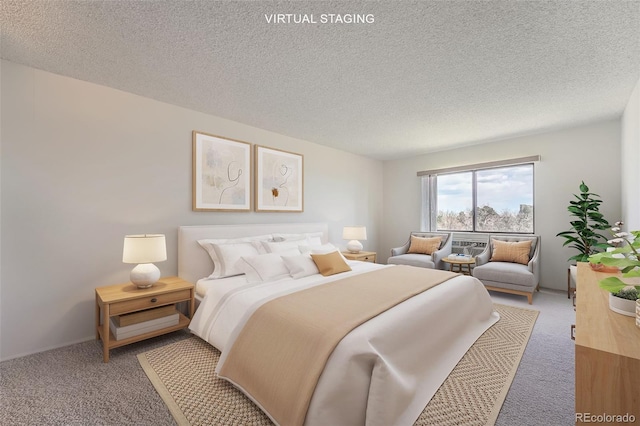 bedroom featuring carpet floors and a textured ceiling
