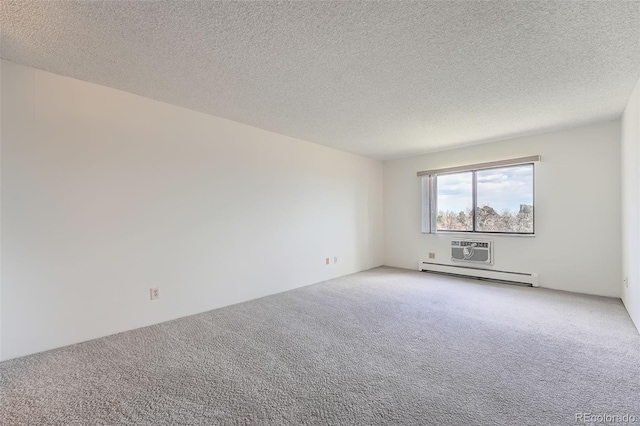 empty room featuring a baseboard radiator, carpet, and a textured ceiling