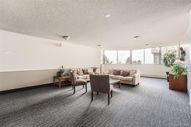 living room with a baseboard heating unit, carpet flooring, and a textured ceiling