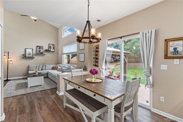 10245 Nottingham Dr, Parker, CO 80134 - dining room featuring a chandelier, healthy amount of natural light, dark wood-style floors, and lofted ceiling