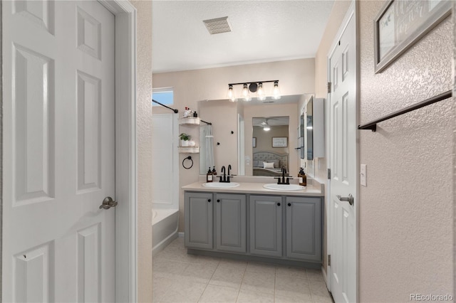 10245 Nottingham Dr, Parker, CO 80134 - ensuite bathroom featuring a ceiling fan, tile patterned floors, shower / bathtub combination, and double vanity