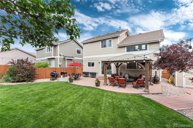 10245 Nottingham Dr, Parker, CO 80134 - rear view of property featuring a gazebo, a fenced backyard, outdoor lounge area, and a patio area
