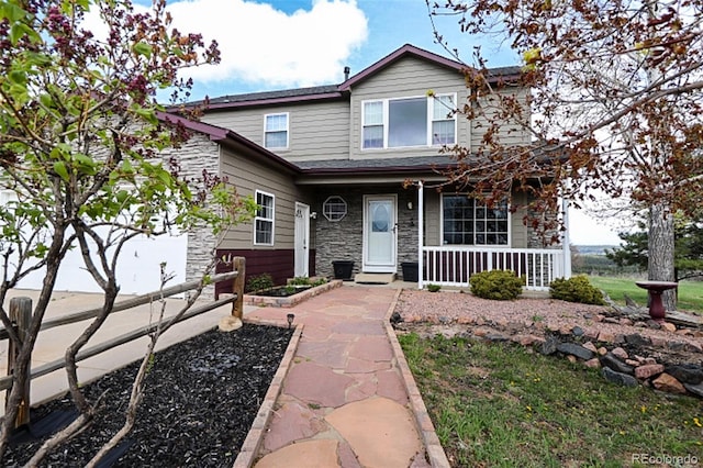 3530 Doolittle Rd, Monument, CO 80132 - traditional-style home with stone siding and covered porch