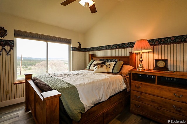 3530 Doolittle Rd, Monument, CO 80132 - bedroom featuring dark wood-style floors, vaulted ceiling, baseboards, ceiling fan, and a wainscoted wall