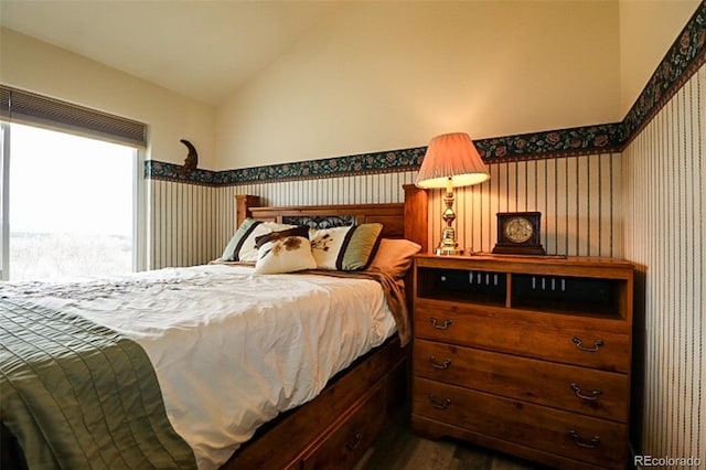 3530 Doolittle Rd, Monument, CO 80132 - bedroom featuring vaulted ceiling, dark wood-style flooring, and wallpapered walls