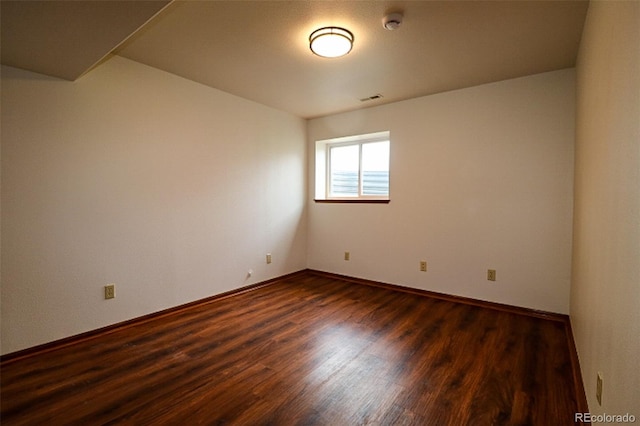 3530 Doolittle Rd, Monument, CO 80132 - empty room with dark wood-style floors, baseboards, and a smoke detector