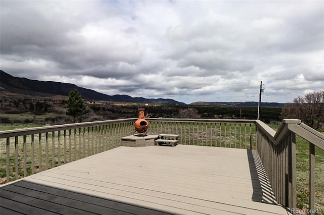 3530 Doolittle Rd, Monument, CO 80132 - wooden deck featuring a mountain view