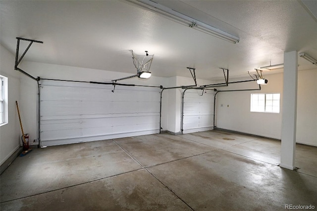 3530 Doolittle Rd, Monument, CO 80132 - garage featuring a garage door opener and baseboards