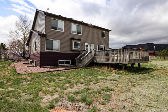 3530 Doolittle Rd, Monument, CO 80132 - back of property featuring a deck and a lawn