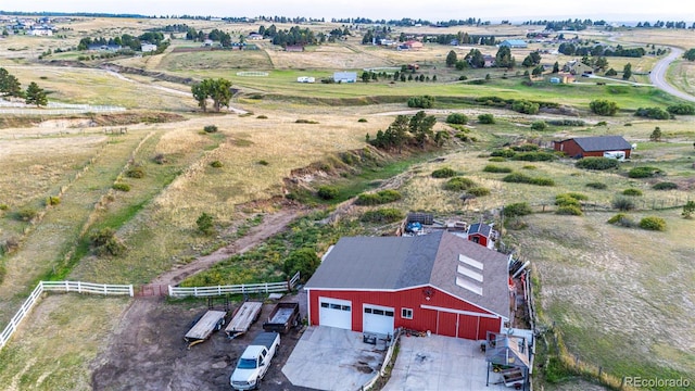 birds eye view of property with a rural view