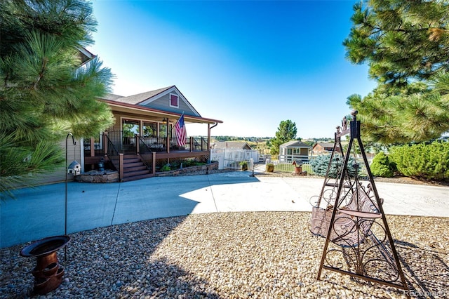 view of play area featuring covered porch