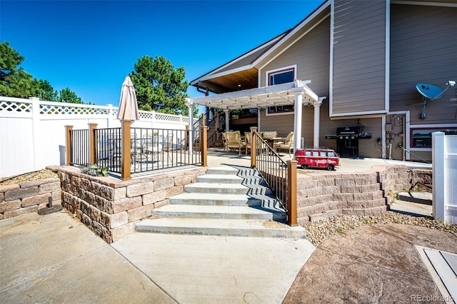 exterior space featuring area for grilling and a pergola