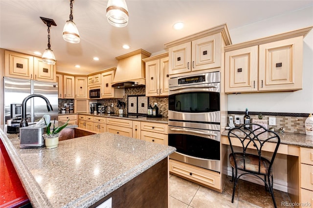 kitchen with decorative light fixtures, decorative backsplash, custom exhaust hood, black appliances, and light stone countertops