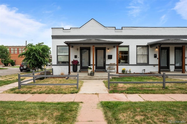 3003 California St, Denver, CO 80205 - multi unit property with brick siding, a fenced front yard, and covered porch